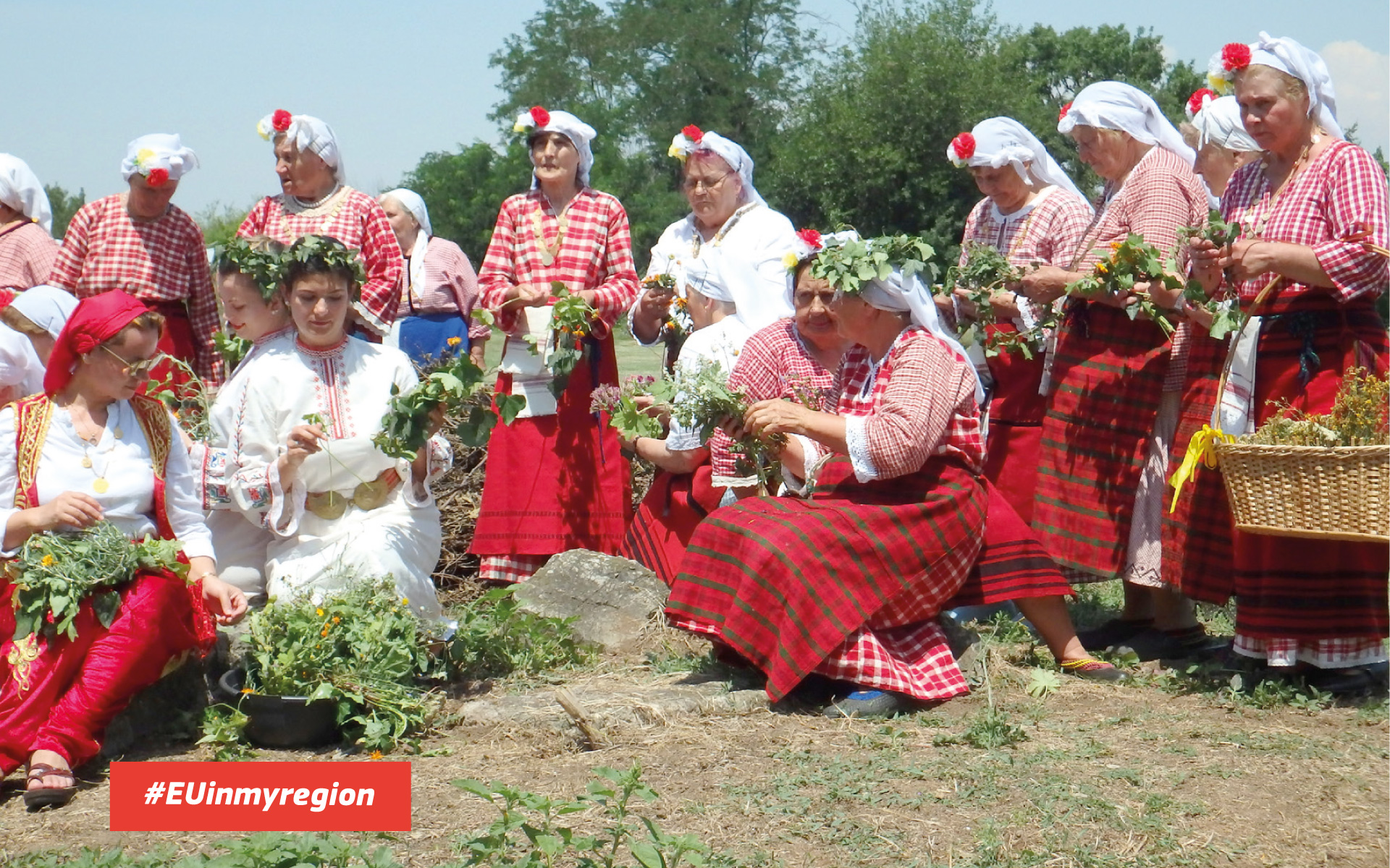 Group of woman in traditional Bulgarian folk costumes gathering plants outdoors, submitted as part of the Europe in my Region campaign with the #EUinmyregion hashtag.